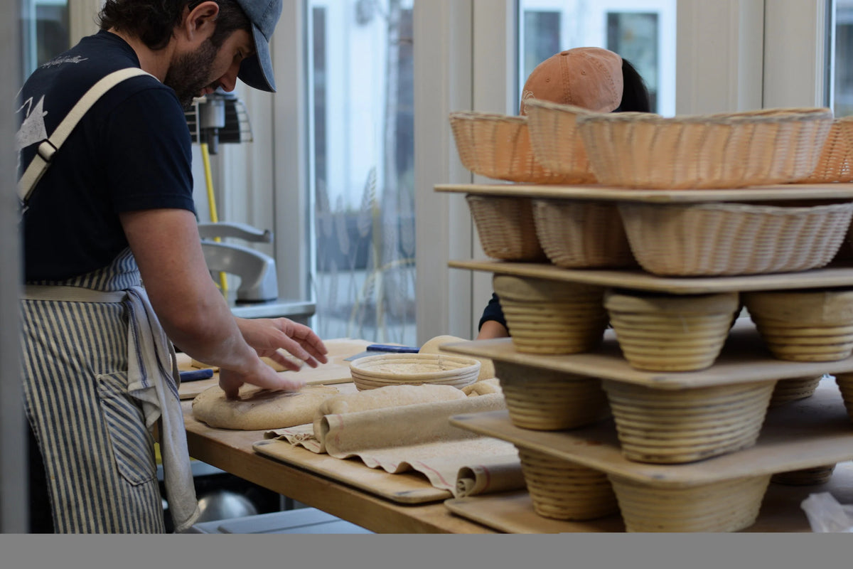 Shaping bread on wooden table