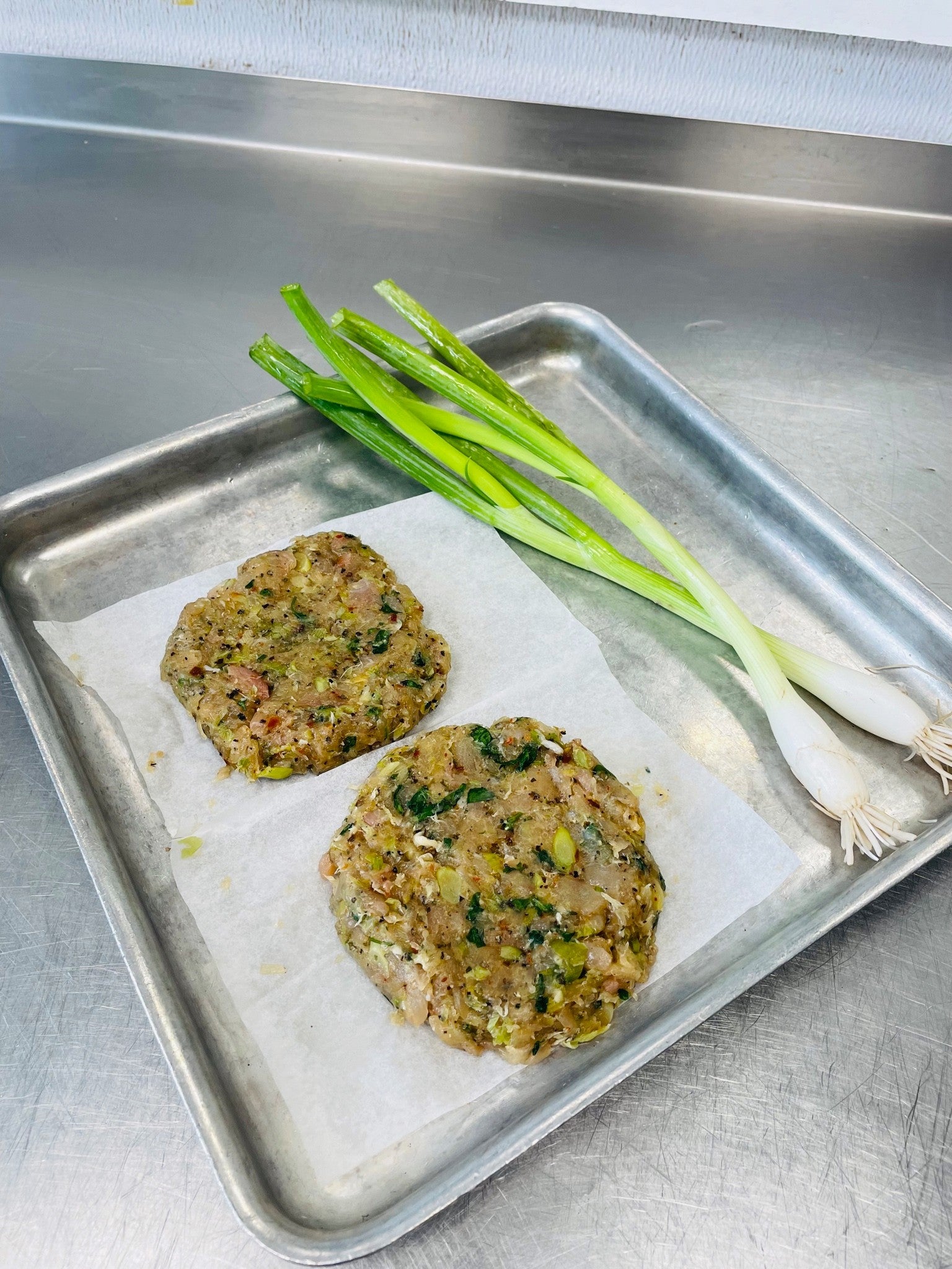 House-made chicken sausage patties with spring onions