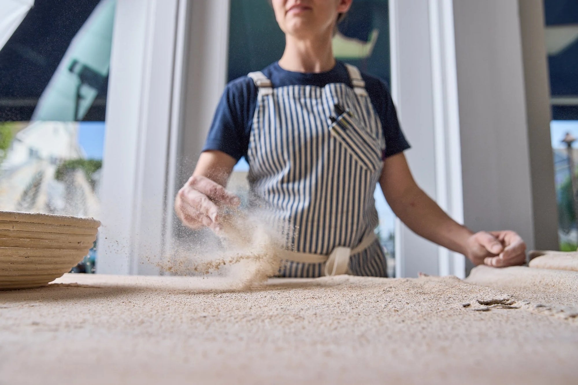 Shaping bread dough by hand