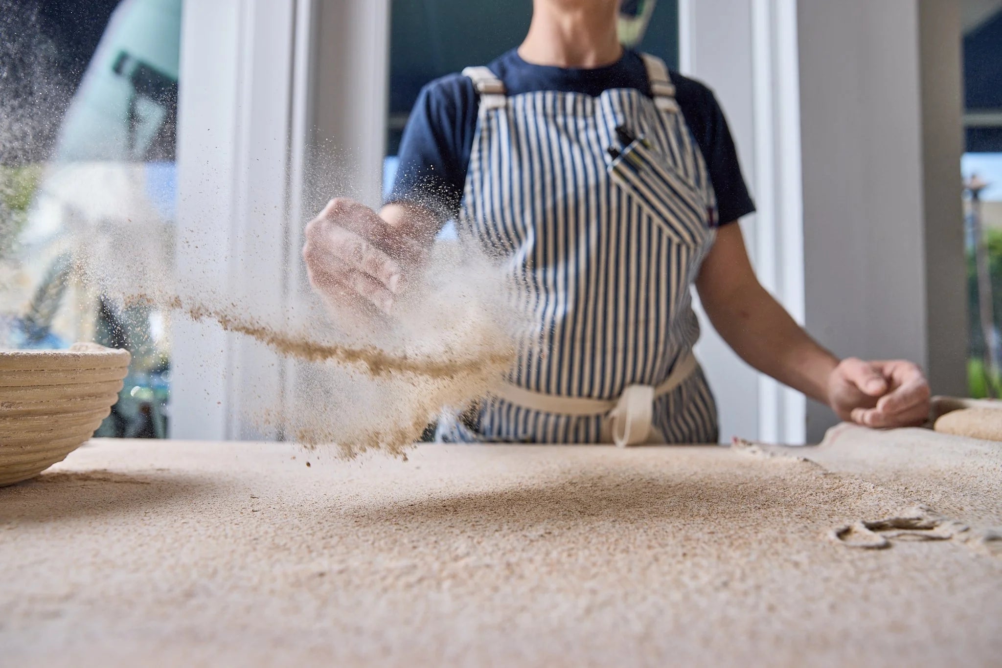 Sifting flour at Kneads